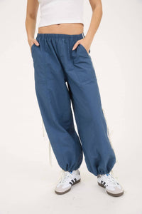 J.O.A. Side Stripe Cut Out Tie Strap Track Joggers in denim - women's pants