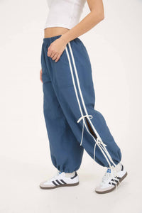 J.O.A. Side Stripe Cut Out Tie Strap Track Joggers in denim - women's pants - detail view