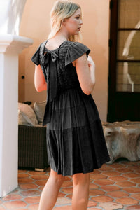 Oddi - Textured Knit Back Tie Tired Mini Dress