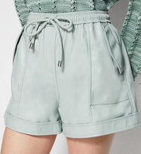 SIMKHAI Doah Vegan Leather Shorts in lichen - women's shorts - detail view