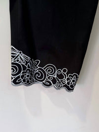 Ann Trinity Women's Embroidered Hem Side Zip Crop Pant in black with white trim - women's pants - alternate view