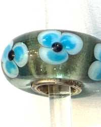 Trollbeads Women's Universal Charm Bead in unique light green blue flowers black dots - women's item - detail view