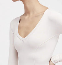 Free People Super Soft Deep V Bodysuit in neutral - women's shirt - detail view