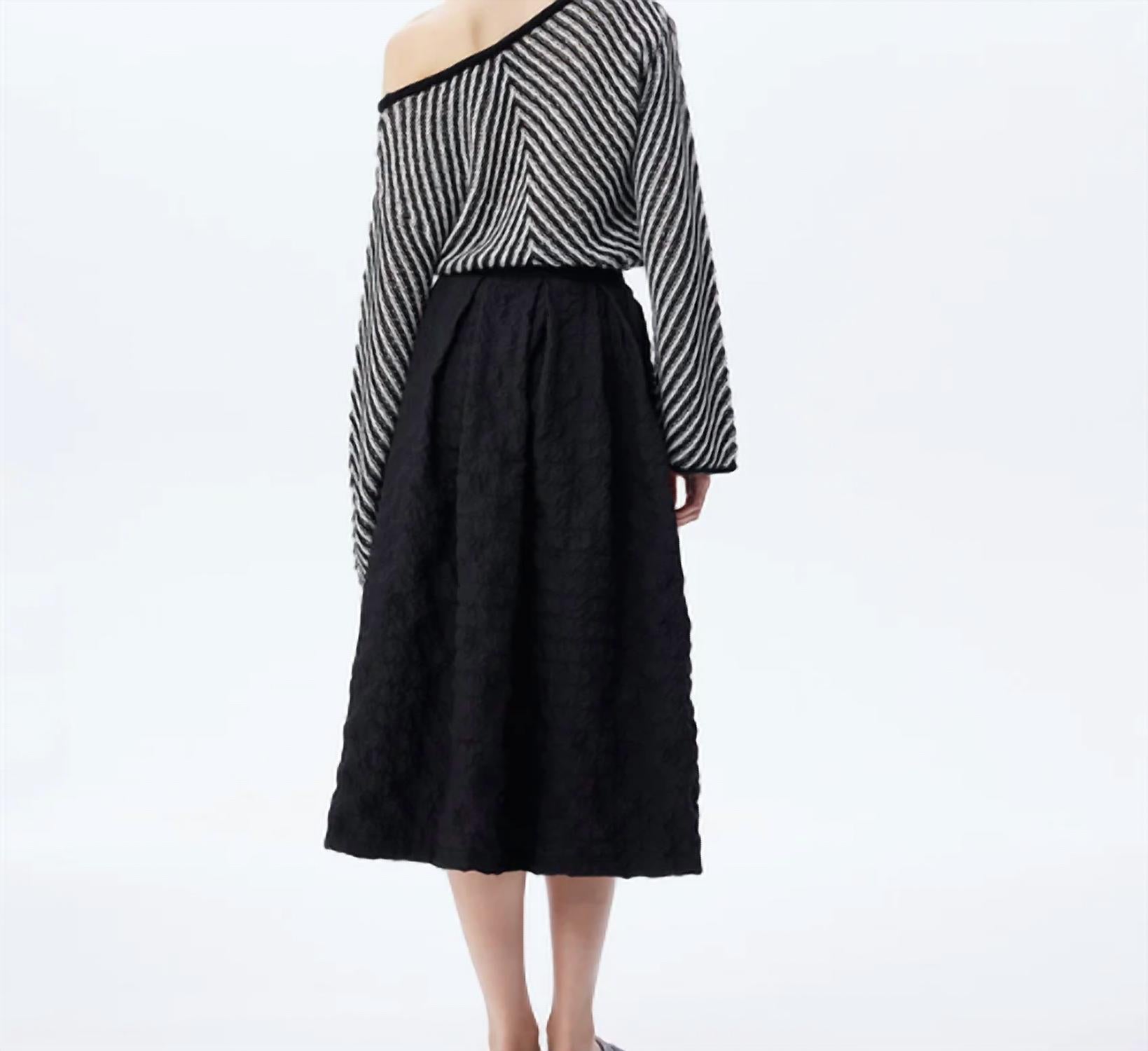 THEO the Label Calypso Plaid Box Pleat Midi Skirt in black - women's skirt - detail view