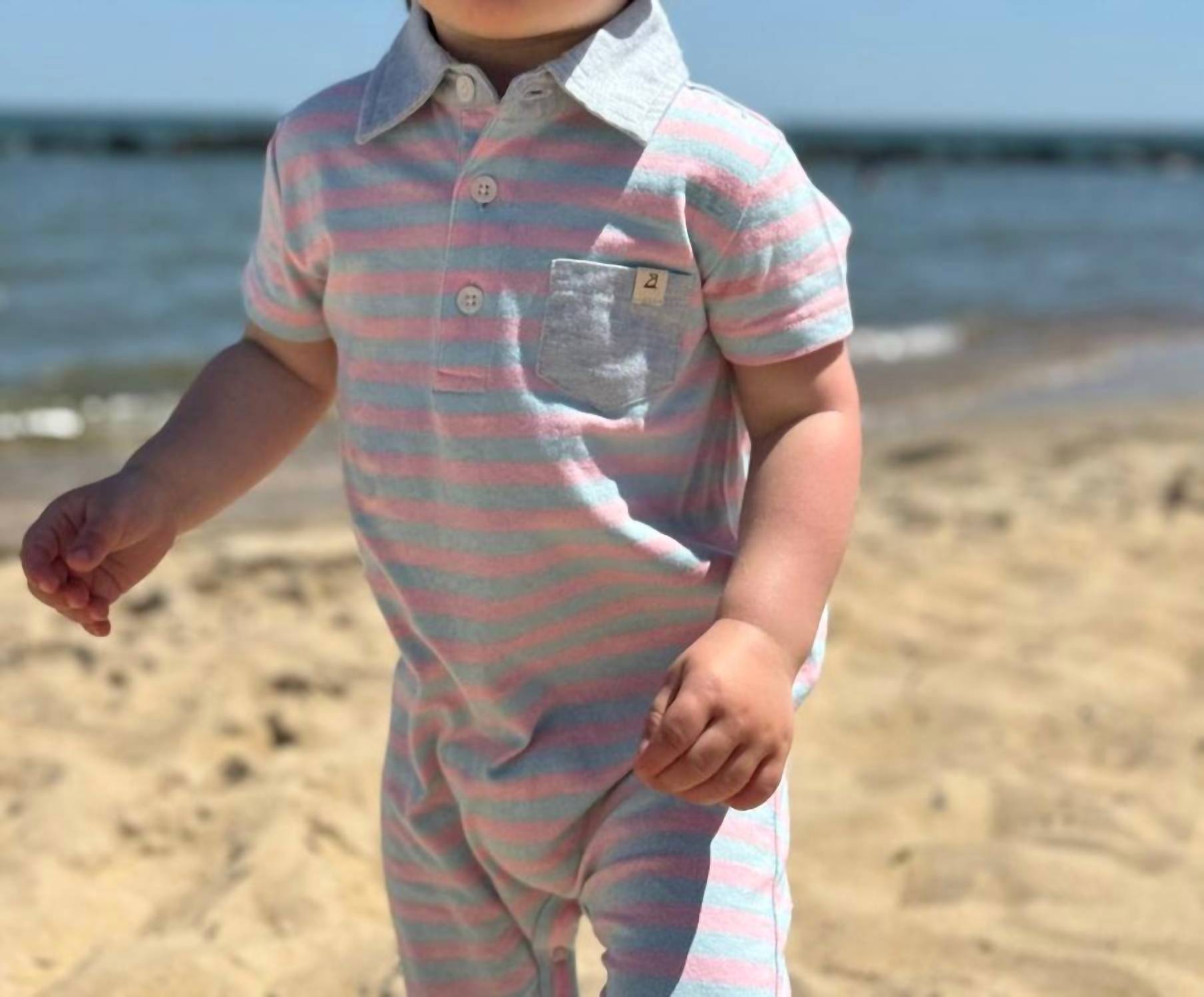 ME & HENRY Boy's Saltash Polo Romper in pink sky - kids' item - detail view
