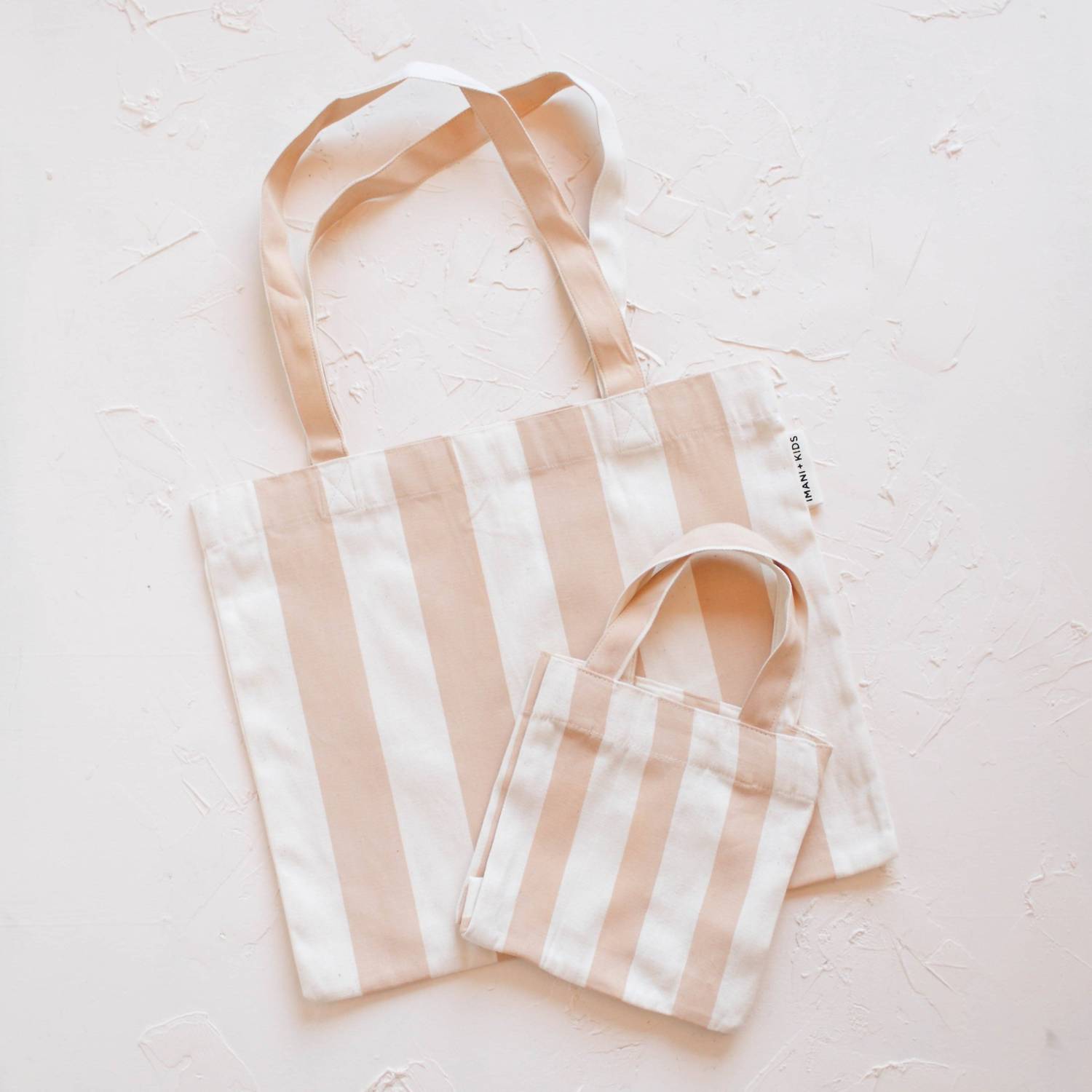 IMANI COLLECTIVE Striped mommy and me tote in pink natural - women's bag - detail view