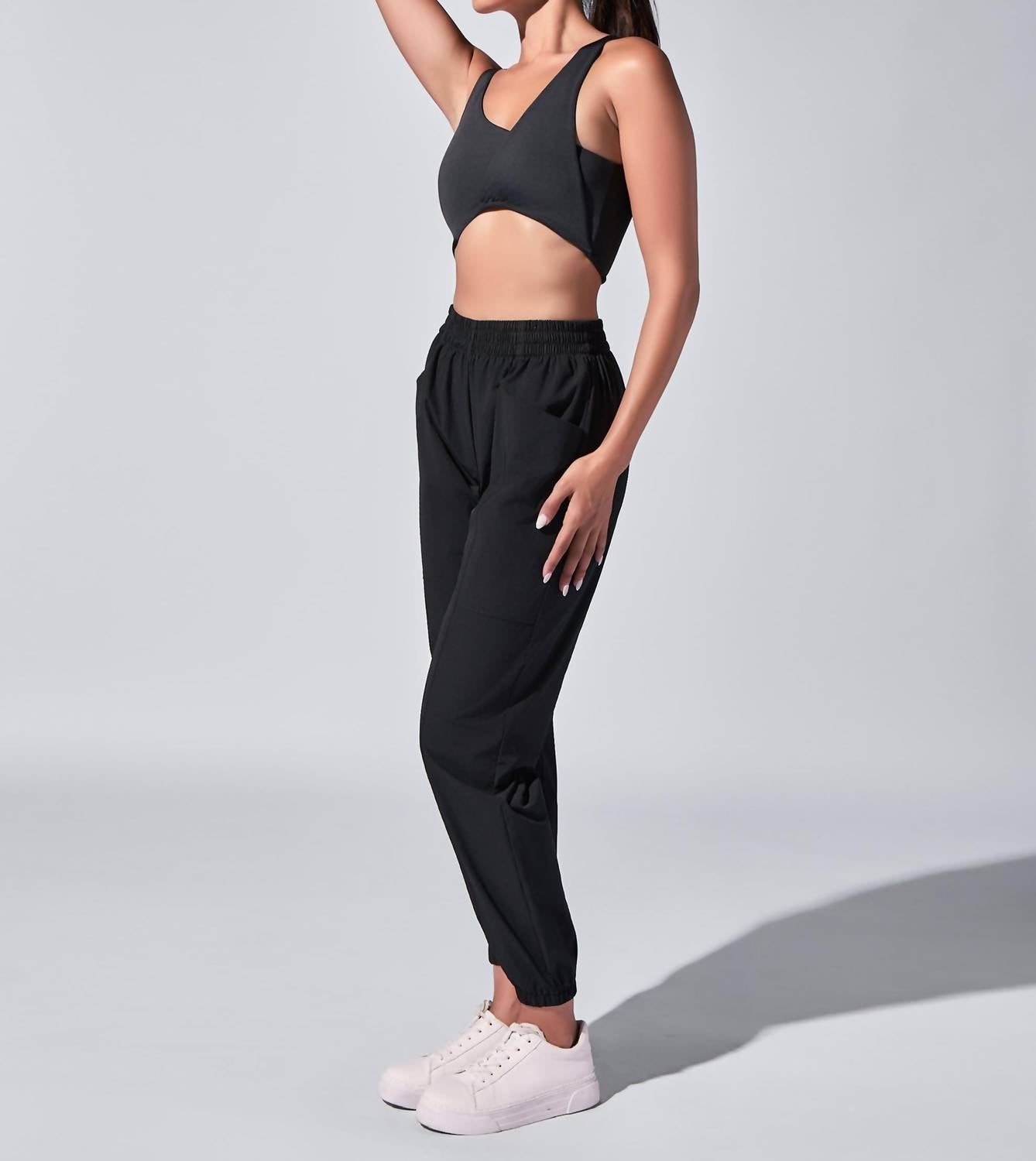 HEROINE SPORT Twisted Symmetric Neck Top in black - women's tank top