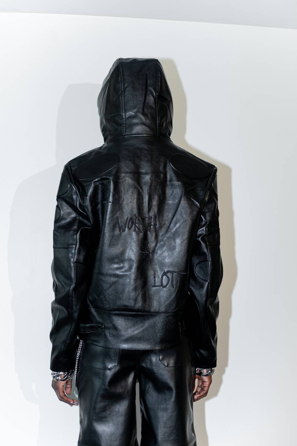 knotWTR Unisex I’m Worth A Lot Leather Jacket With Hood in black - women's jacket - detail view
