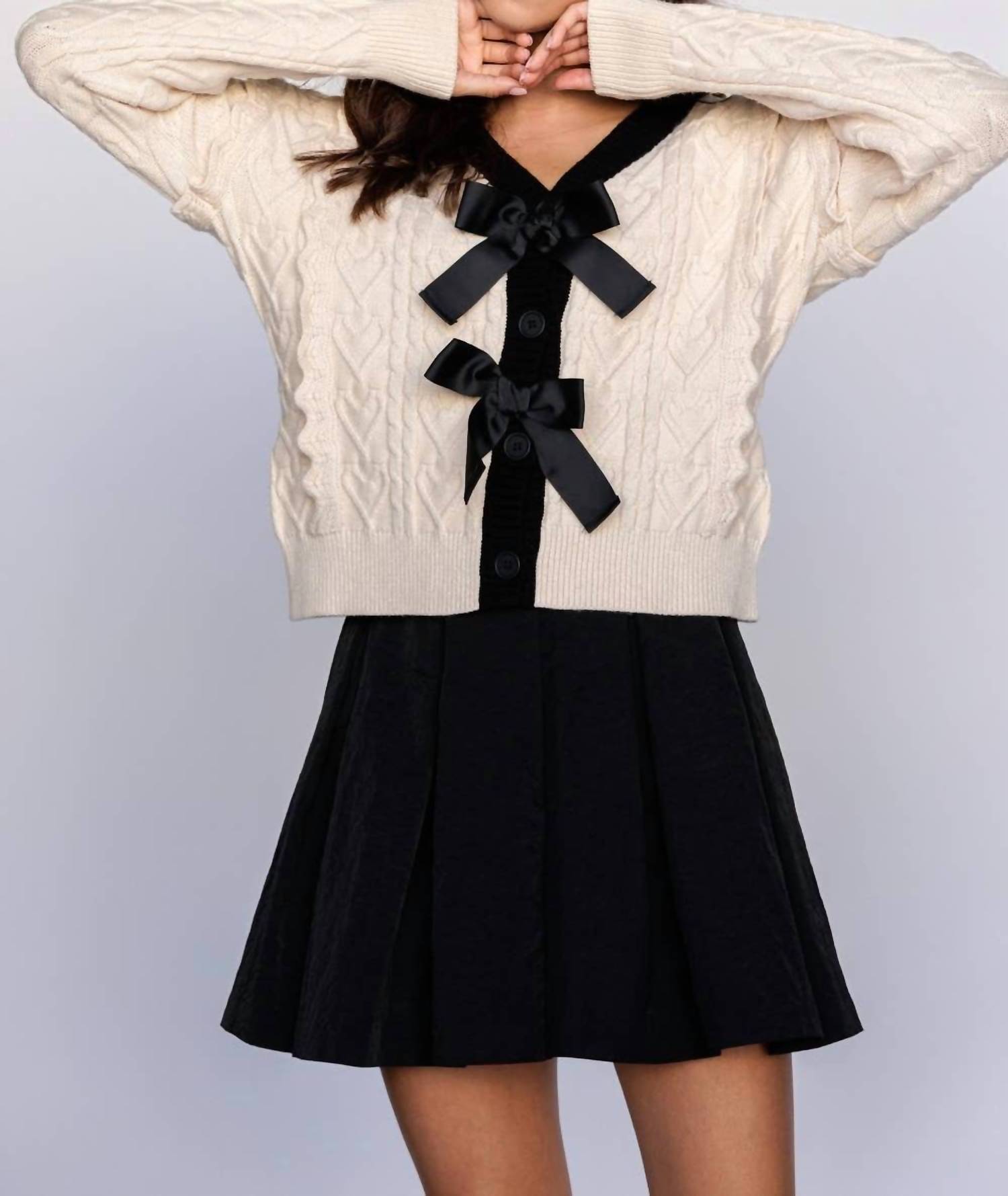 Storia - CABLE KNIT CARDIGAN WITH BOWS
