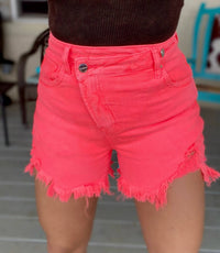RISEN Ada Asymmetrical Distressed Shorts in coral pink - women's shorts - detail view