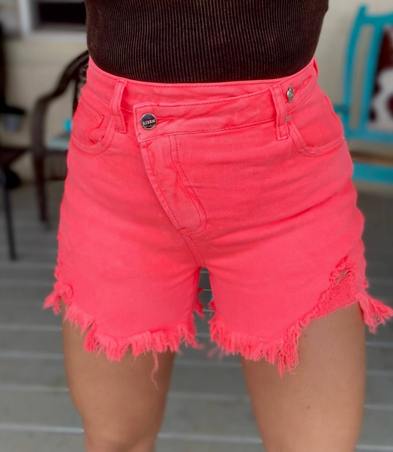RISEN Ada Asymmetrical Distressed Shorts in coral pink - women's shorts - detail view