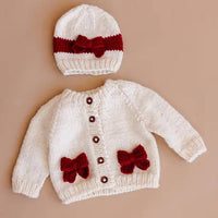 The Blueberry Hill Kid's Cozy Knit Cardigan With Bow in cream red - kids' sweater - detail view
