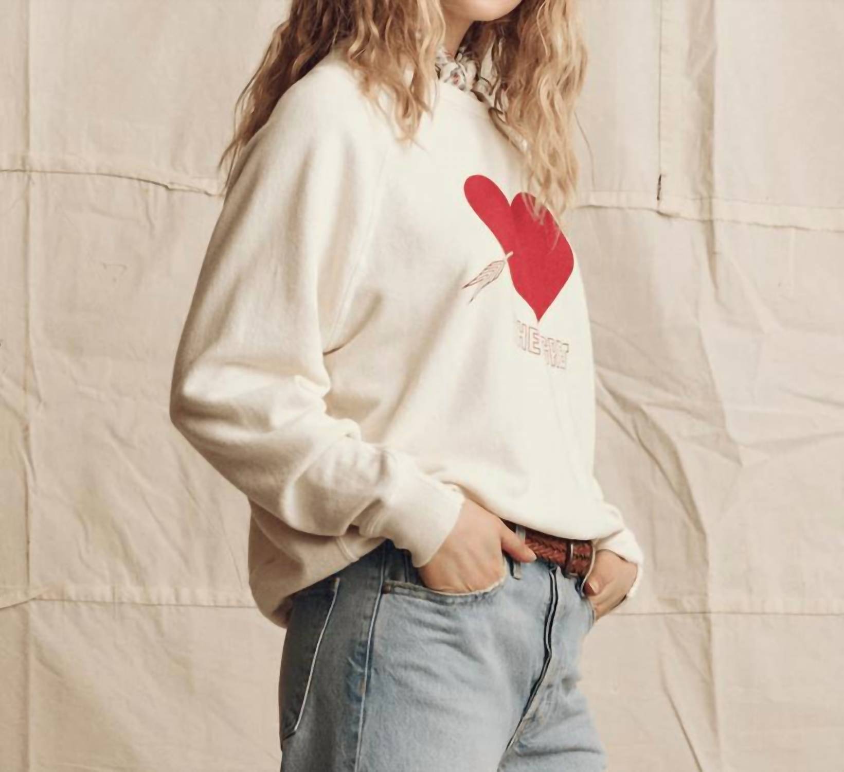 THE GREAT. College Sweatershirt With Heart Graphic in washed white with red - women's top - detail view