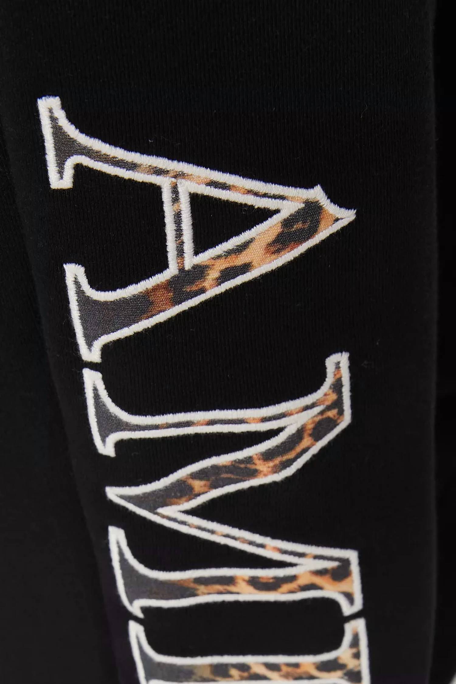 Amiri Leopard Applique Sweatpants in black - men's pants - view 4