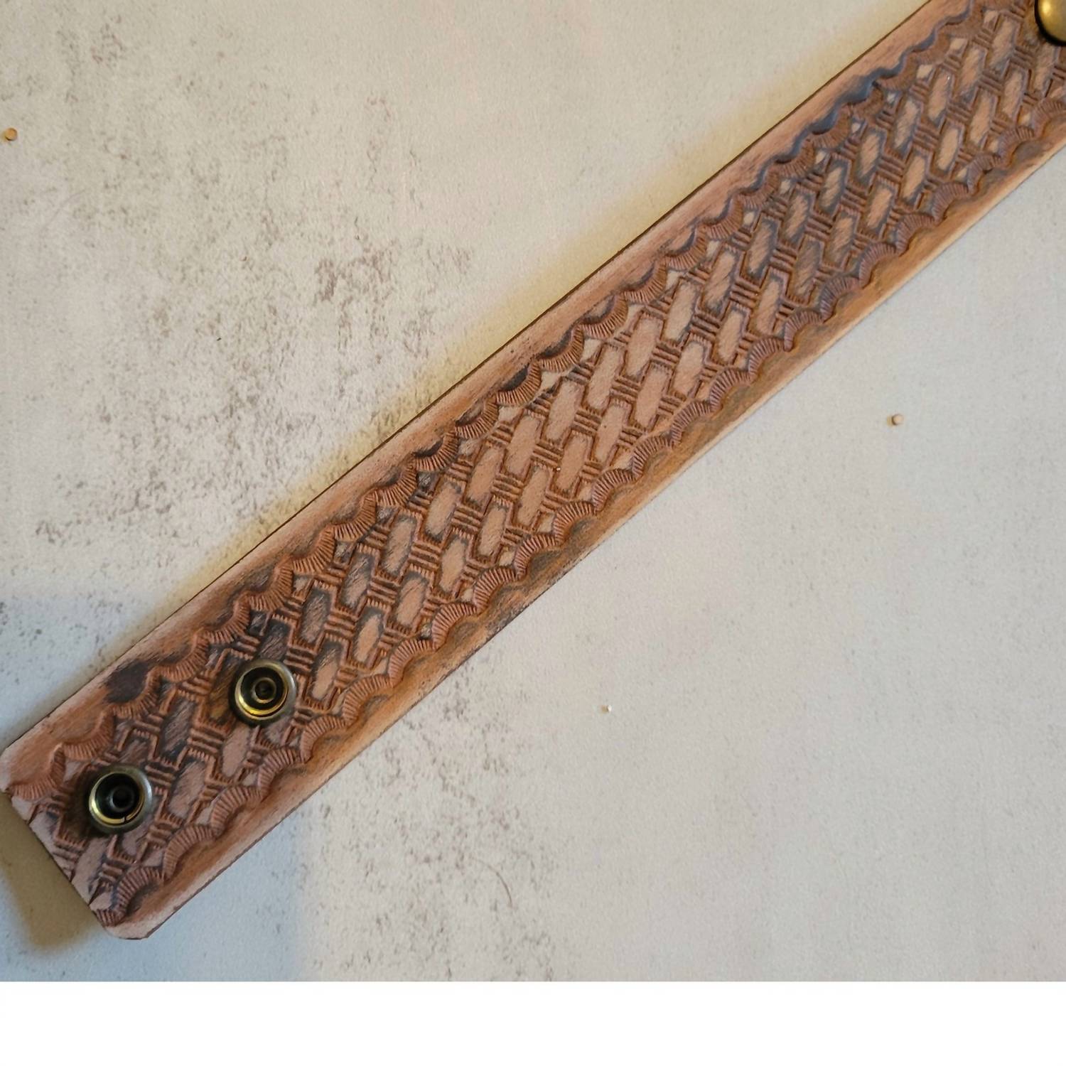 A Rare Bird Women's Hand Tooled Leather Bracelet in brown - women's jewelry - detail view