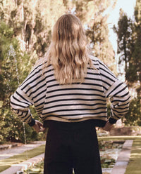 THE GREAT. Women's The Roll Neck Pullover Top in black and cream stripe - women's sweater - detail view