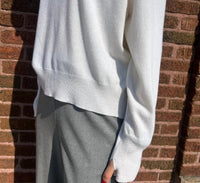 The 73 Asymmetrical Collar Sweater Top in ecru - women's sweater - detail view