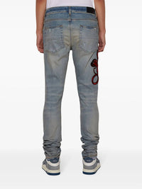 Amiri - Snake Patch Skinny Ripped Jeans