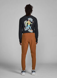 Janji Transit Tech Pant in cabin - men's pants - detail view