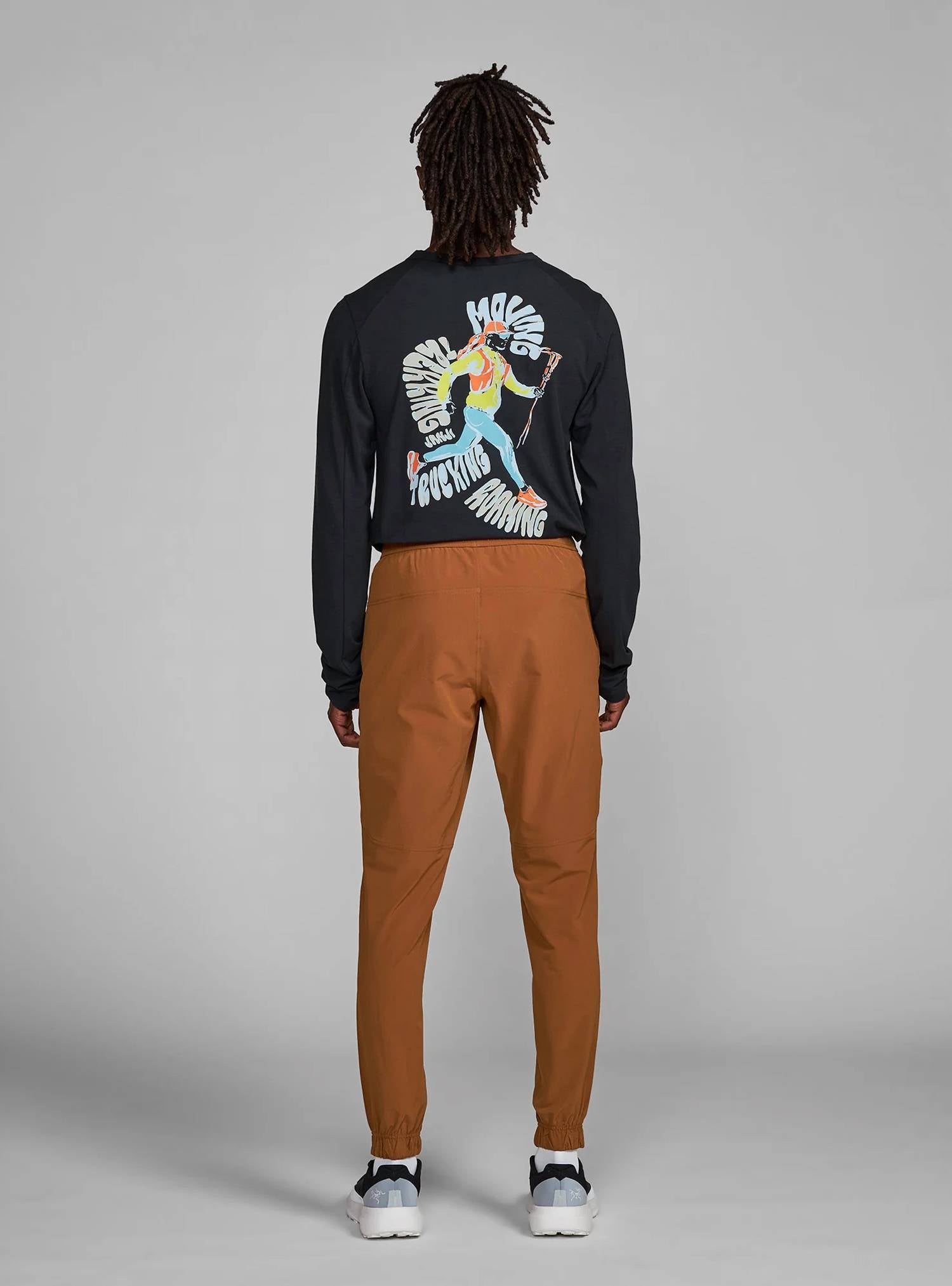 Janji Transit Tech Pant in cabin - men's pants - detail view