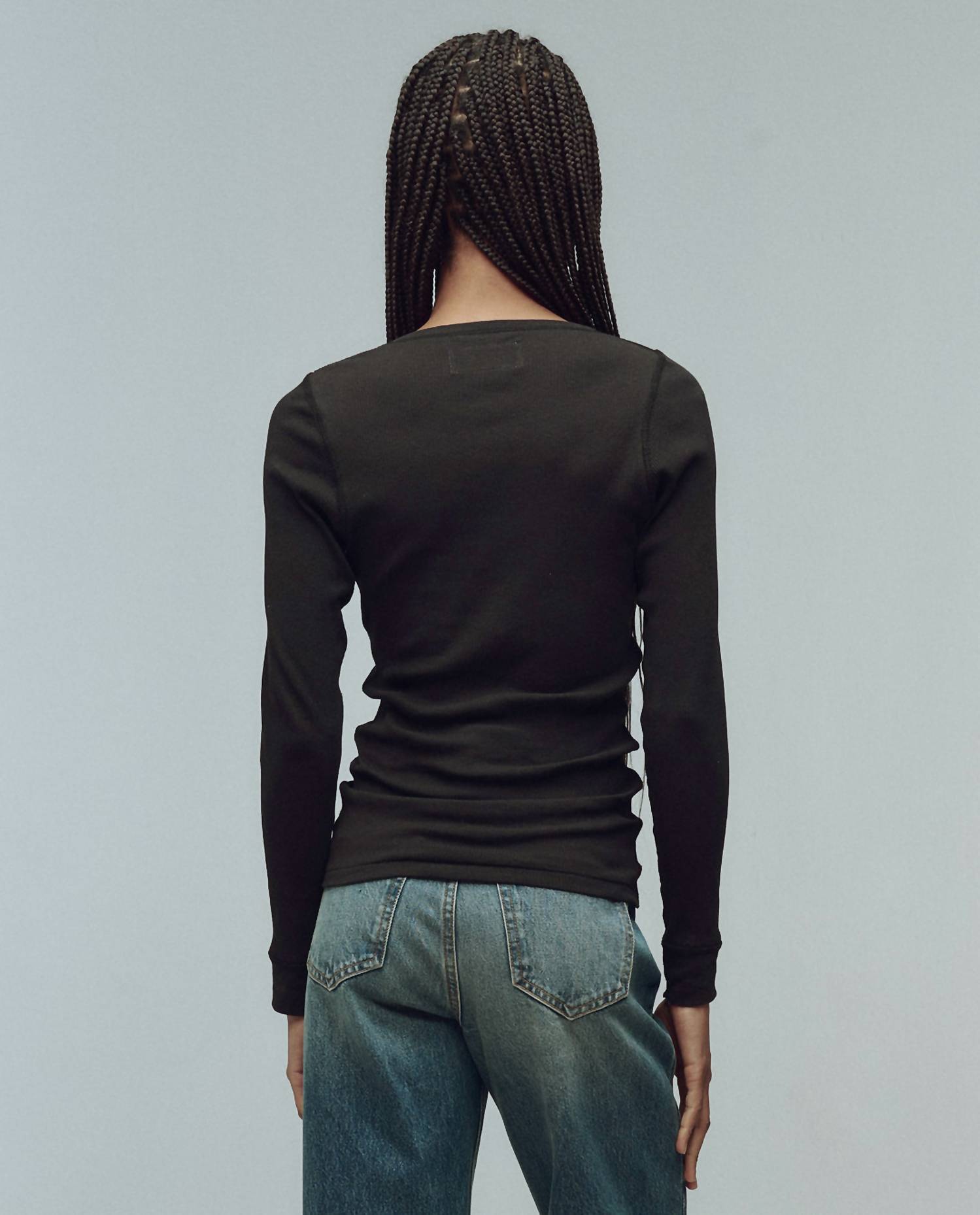 THE GREAT. The Baby Rib Henley Top in black - women's long sleeve top - detail view