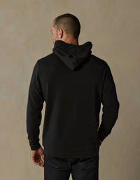 The Normal Brand Puremeso Essential Long Sleeve Hoodie in black - men's shirt - detail view