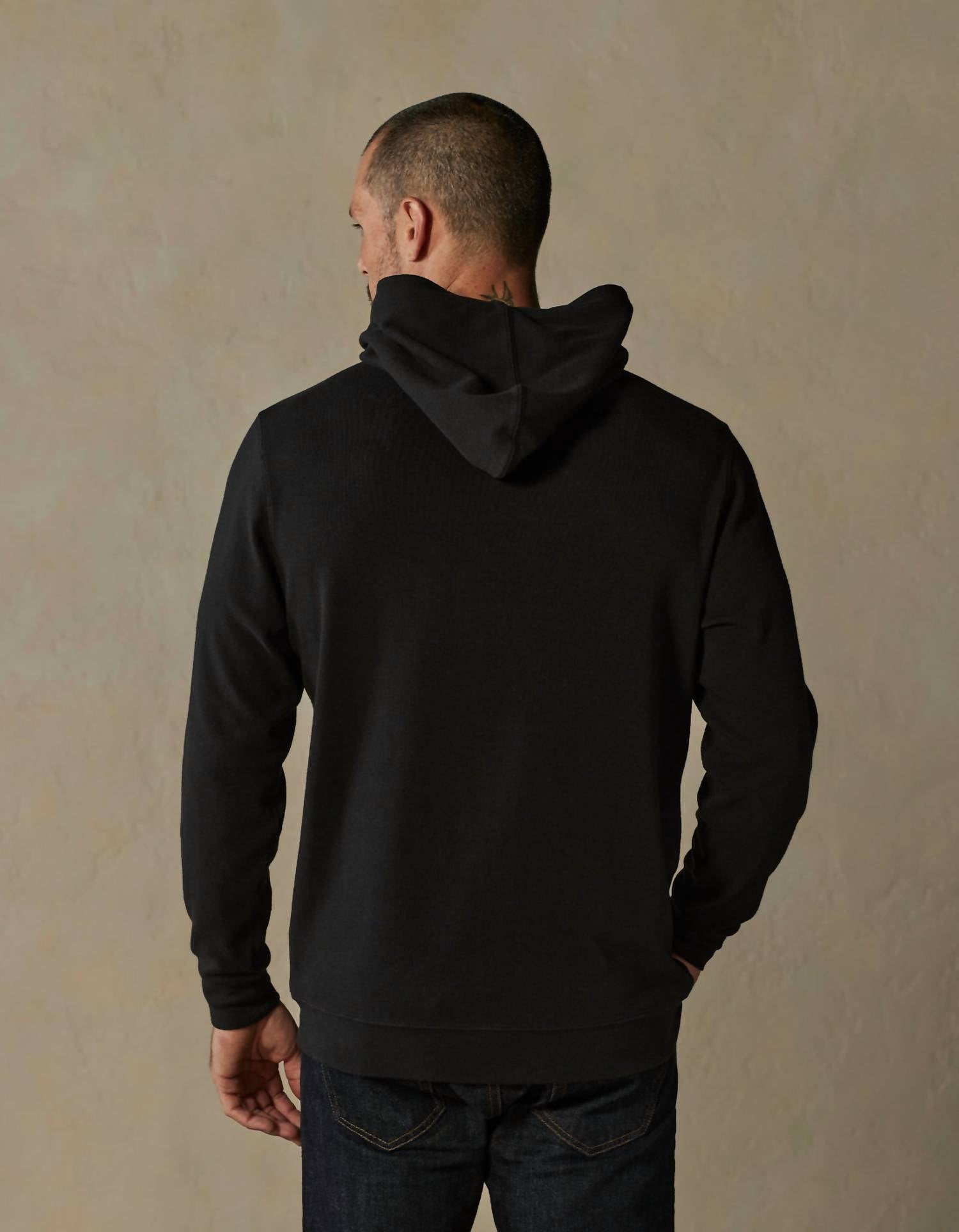 The Normal Brand Puremeso Essential Long Sleeve Hoodie in black - men's shirt - detail view