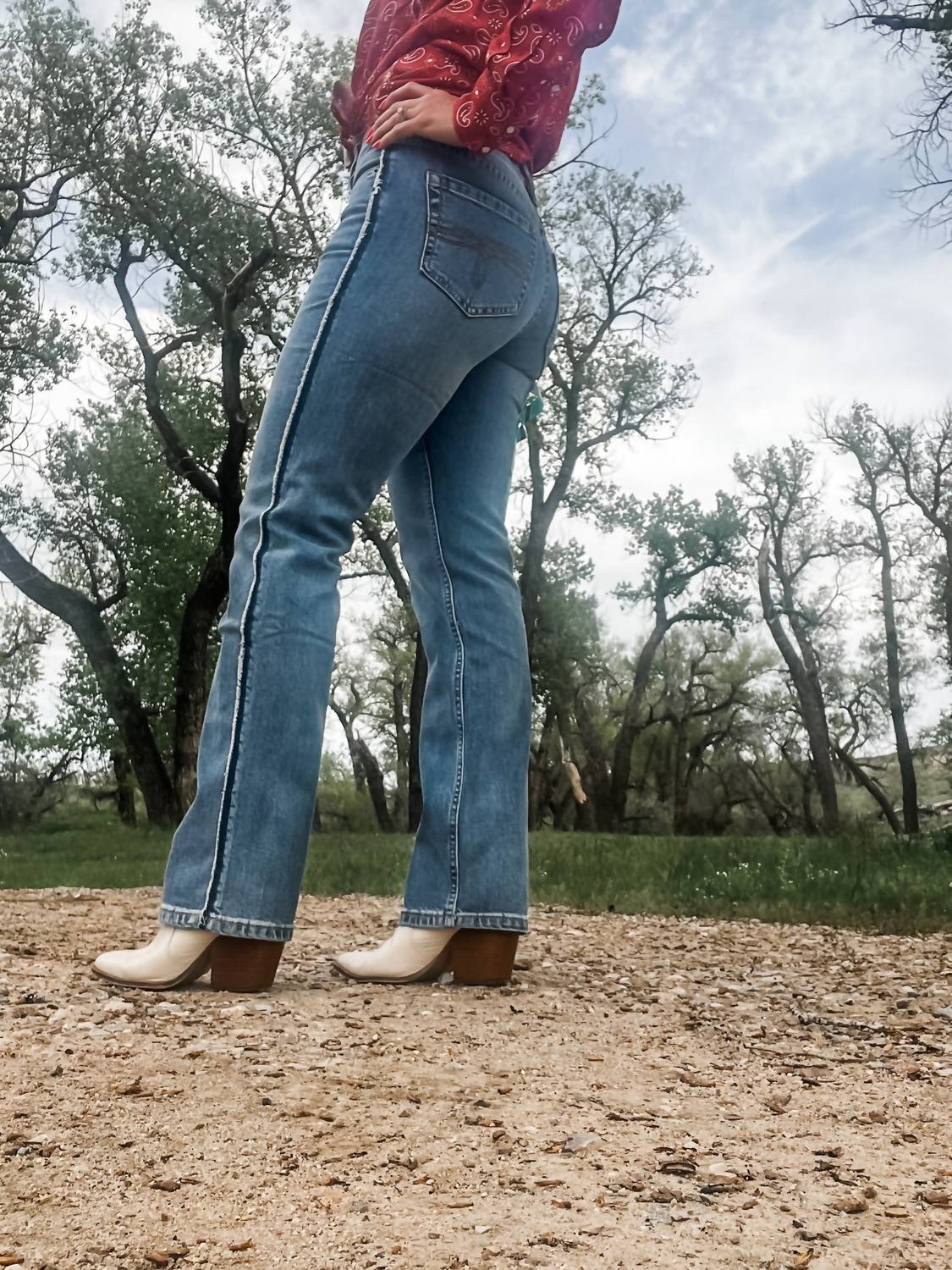 Rock & Roll Denim Raw Side Seam Modern Bootcut Jeans in medium wash - women's jeans - detail view