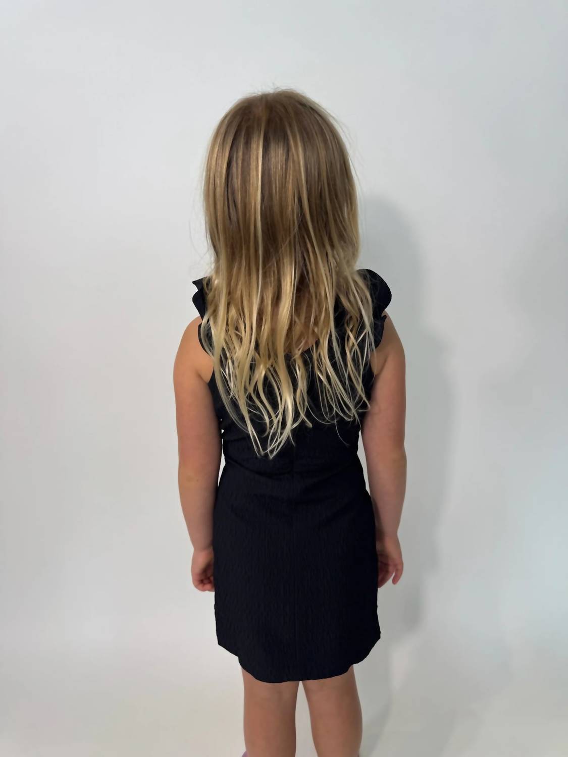 little Olin Girls Ruffle Dress in black - kids' dress - detail view