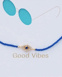 TAI Women's Good Vibes Card Bracelet in gold blue evil eye - women's jewelry - detail view