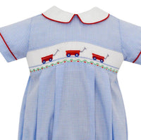petit bebe Girls Smocked Bubble Onesies in red wagons - kids' item - detail view