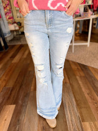 BLAKELEY Shiloh Distressed Flare Jeans in light wash - women's jeans
