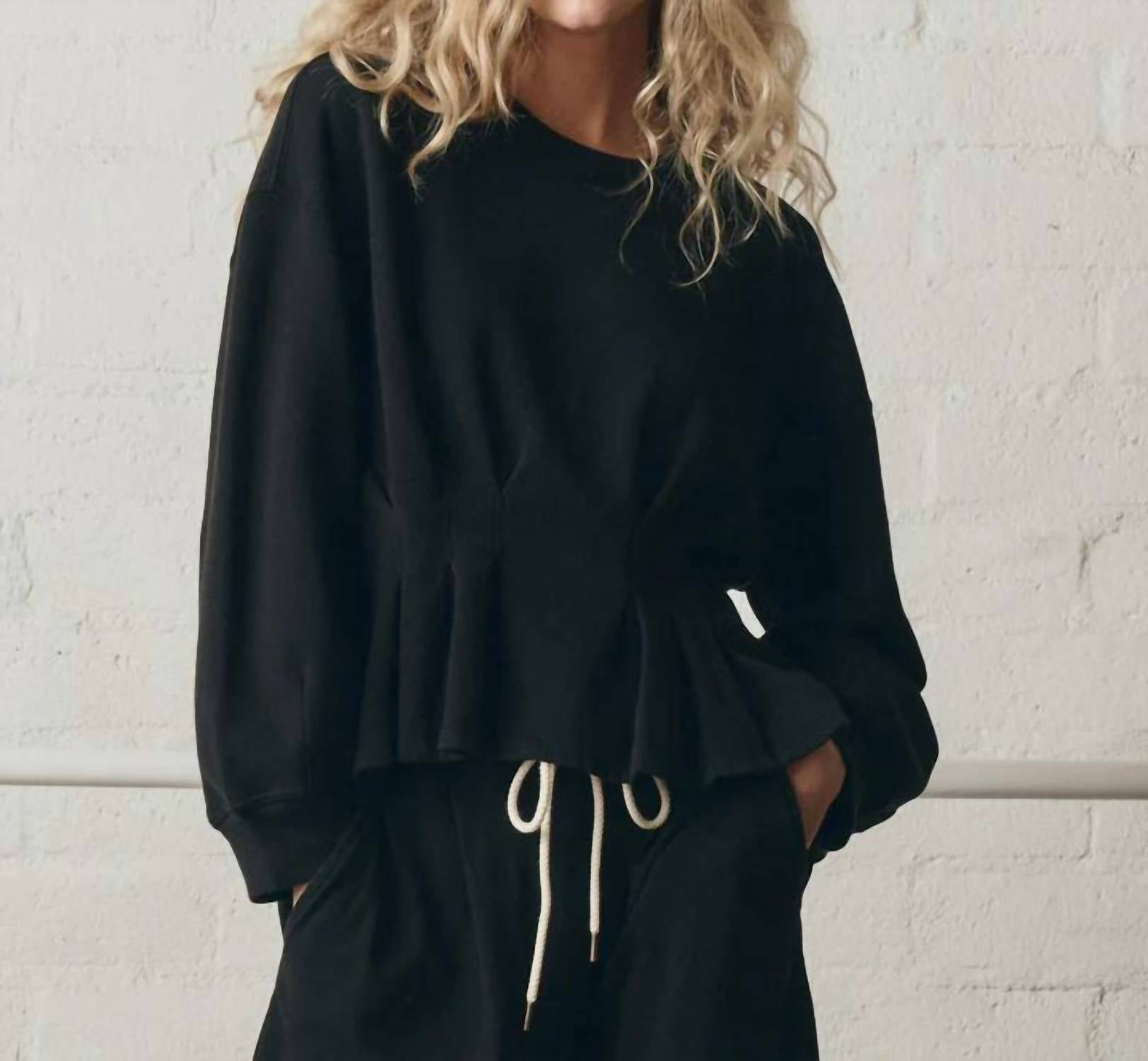 THE GREAT. The Slouchy Corset Sweatshirt in true black - women's top - detail view