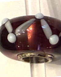 Trollbeads Women's Universal Charm Bead in burgandy white raised dots - women's item - detail view