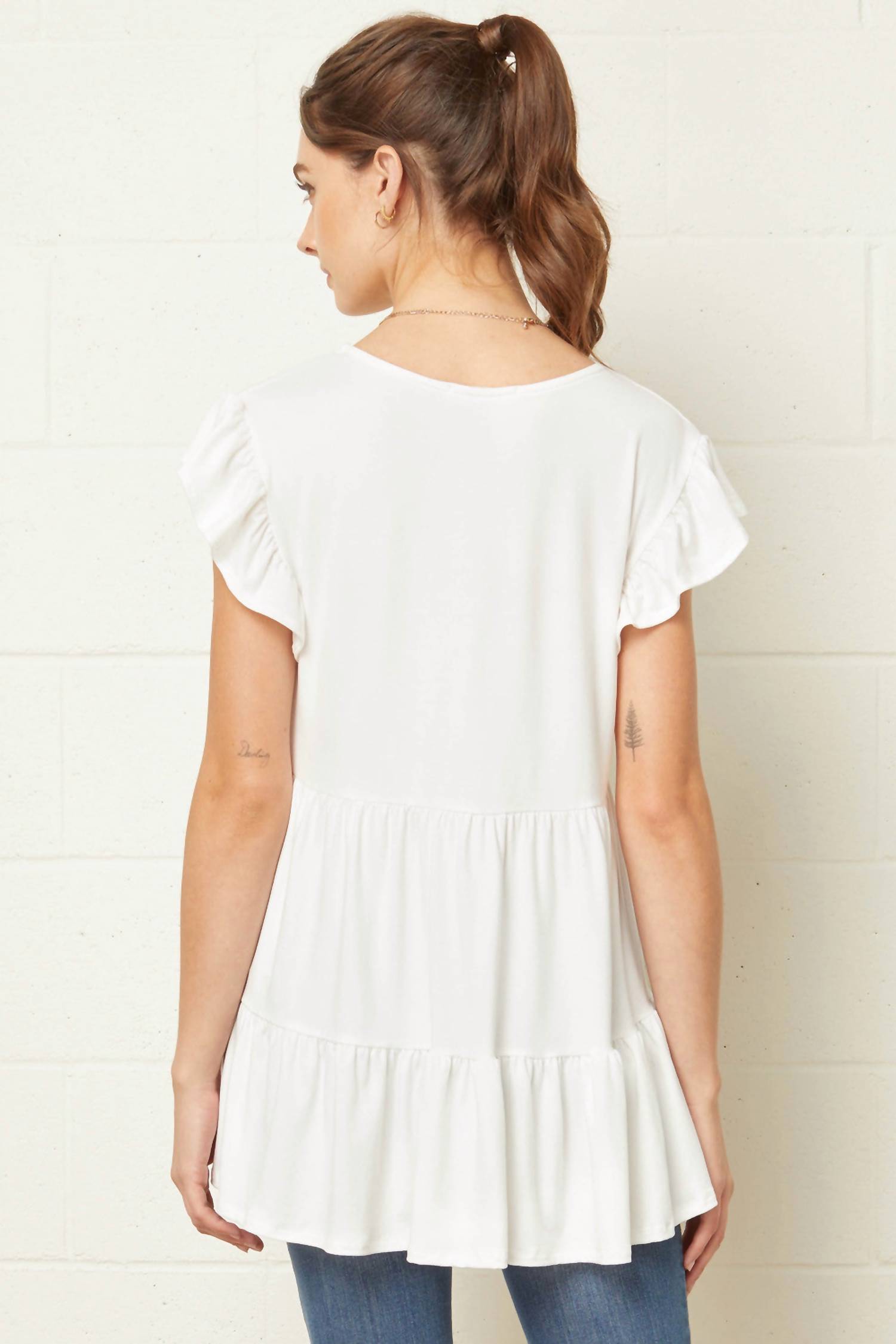 entro Tiered Ruffle Babydoll Top in ivory - women's blouse - detail view