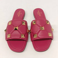 Valentino Garavani Women's Roman Stud Quilted Leather Slides in pink gold - women's shoe - detail view