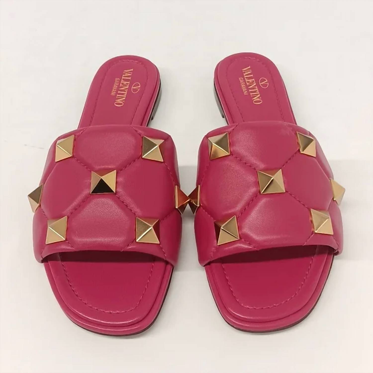 Valentino Garavani Women's Roman Stud Quilted Leather Slides in pink gold - women's shoe - detail view