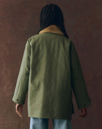 THE GREAT. Reversible Quilted Liner Parka Jacket in army hot orange - women's jacket - detail view