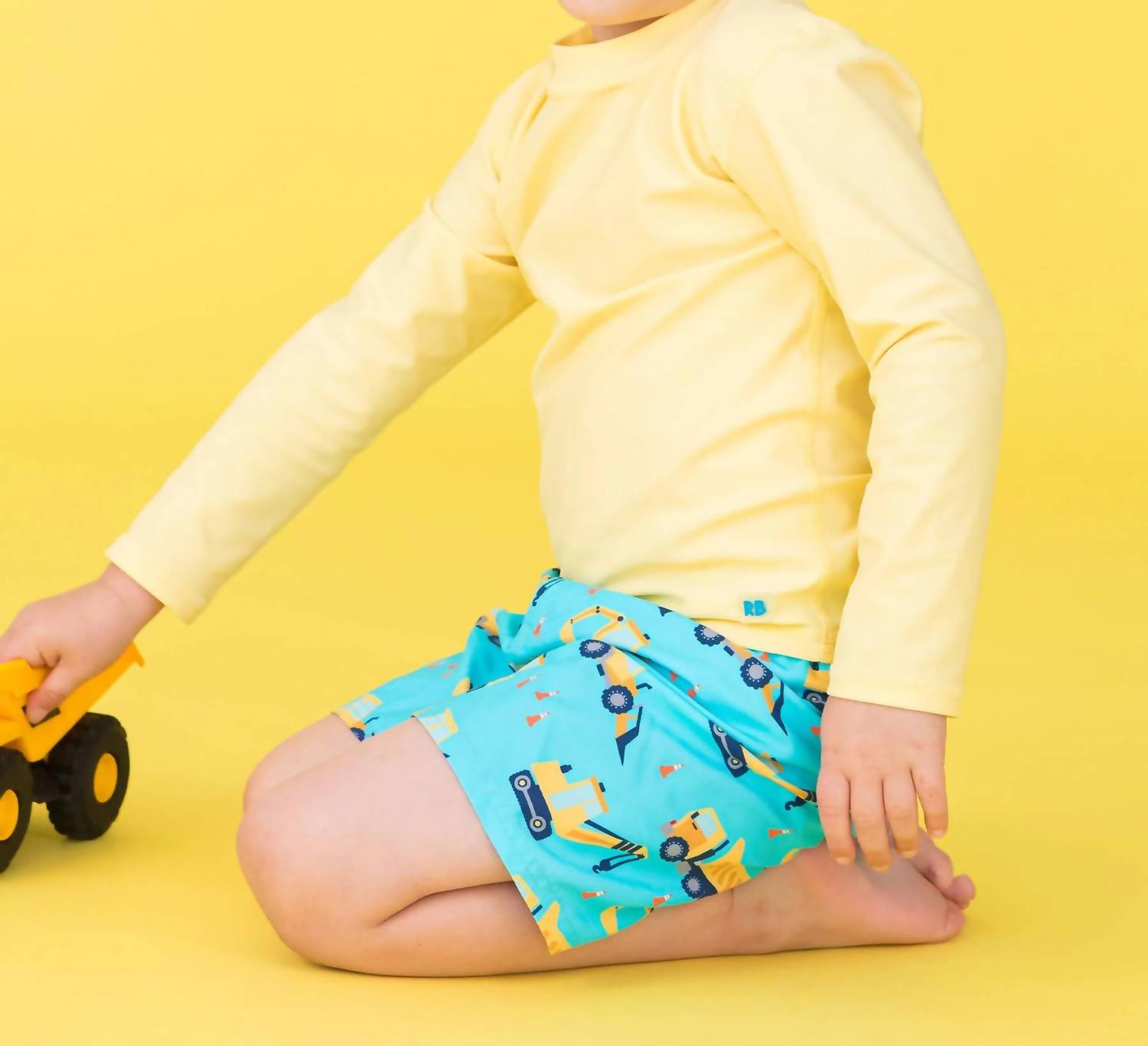 Rufflebutts - Boy's Under Construction Swim Trunks