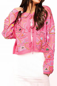 QUEEN OF SPARKLES Groovy Heart Tie Up Sweater in hot pink 1 - women's cardigan - detail view