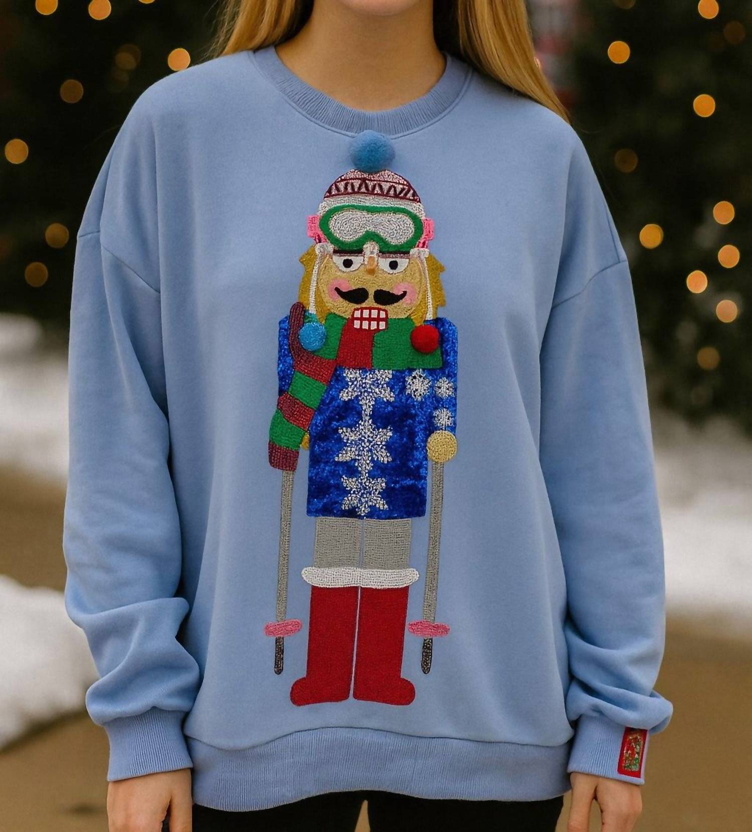 QUEEN OF SPARKLES Skiing Nutcracker Sweatshirt in powder blue - women's top