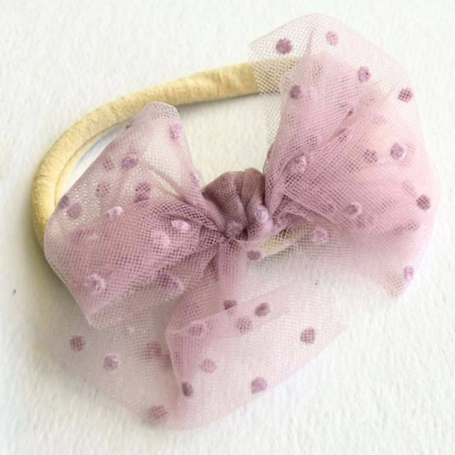 A Little Lacey Baby Bow Headband in lilac - kids' accessory - detail view