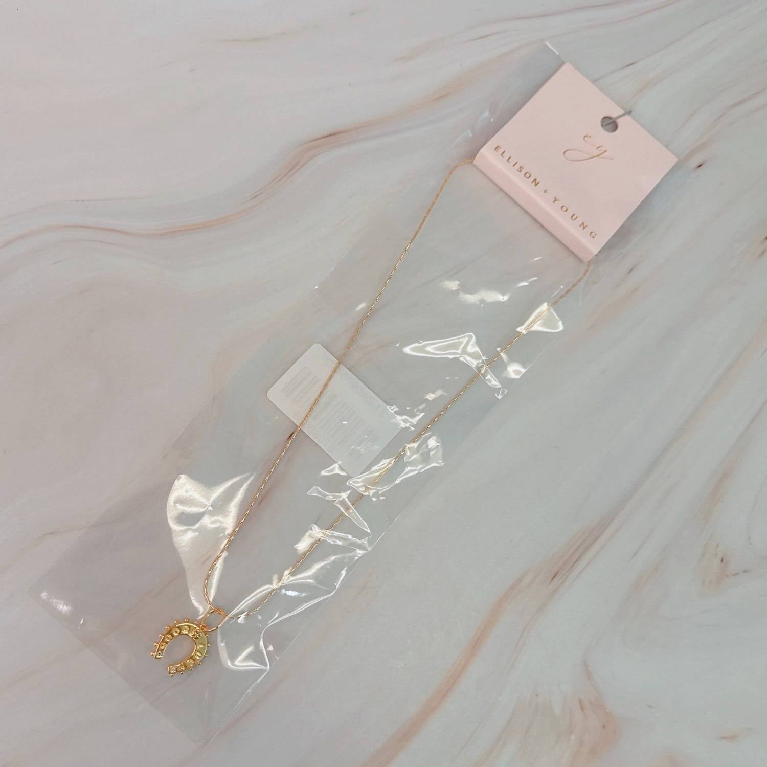 Ellison+Young Women's Lucky Horseshoe Necklace in gold - women's jewelry - detail view