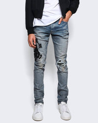 Amiri Wes Lang Reaper Logo Jeans in clay indigo - men's jeans