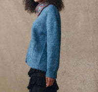 THE GREAT. The Brushed Melange Cardigan in winteride blue - women's cardigan - detail view