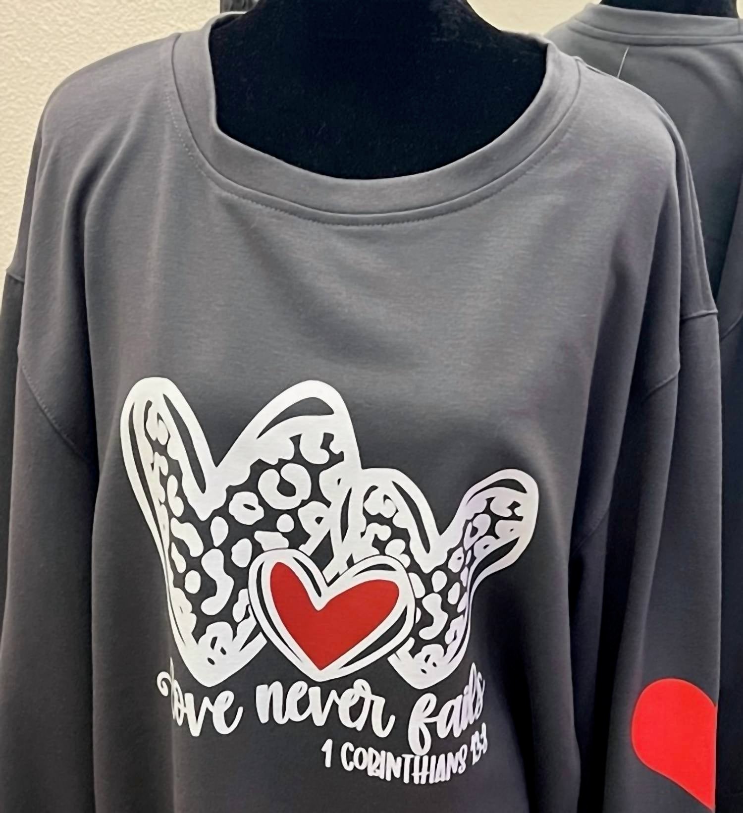 Unishe - Women's Love Never Fails Sweatshirt